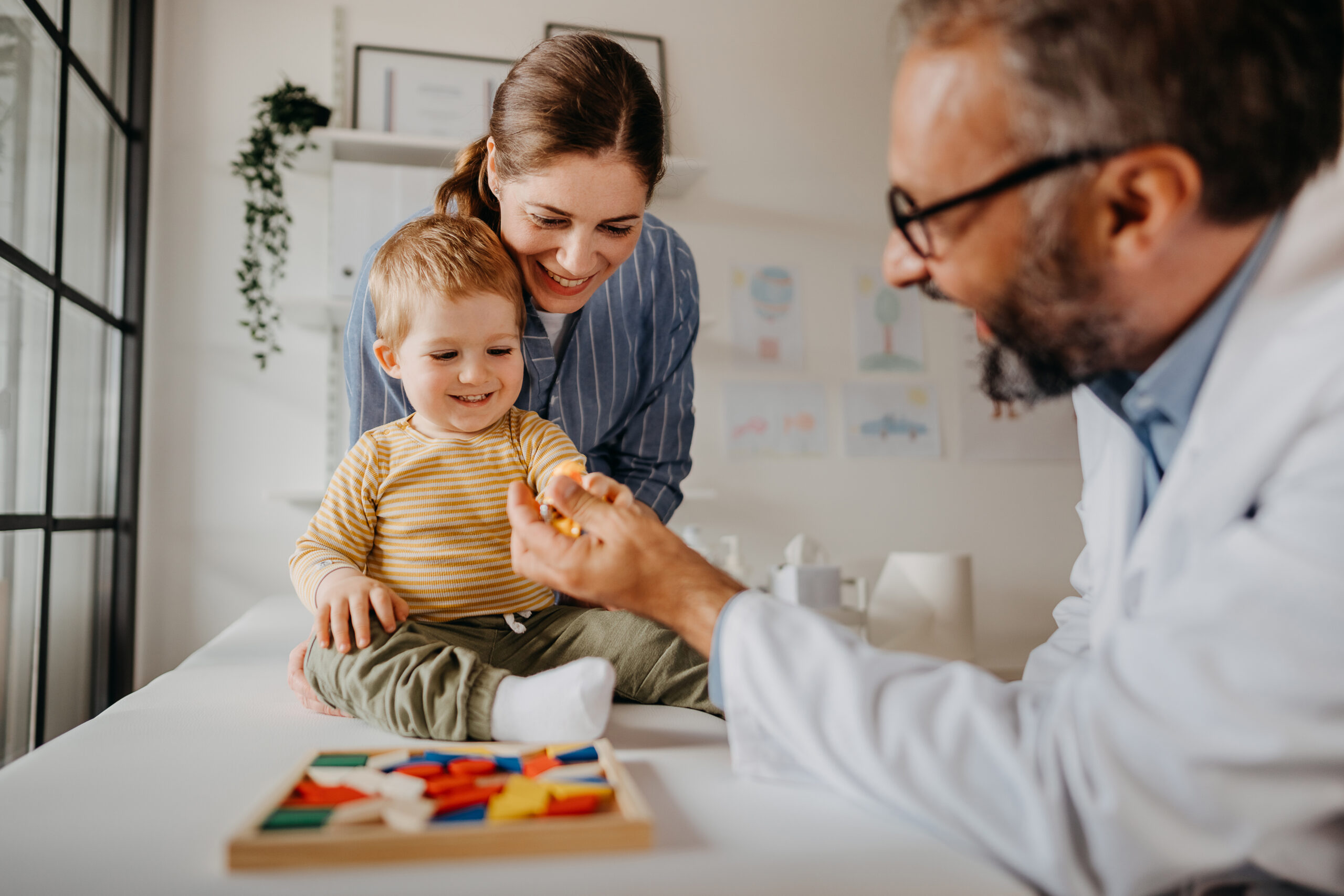 A doctor examines a child with food allergy as part of a clinical research trial.